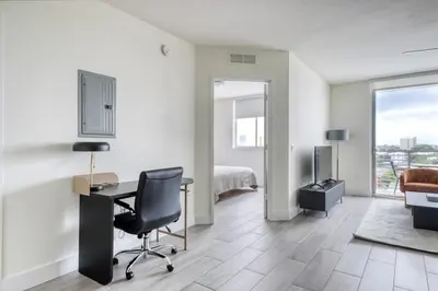 a living room with a desk and a bedroom at Little Havana 1br w pool gym near restaurants MIA-48 in Miami