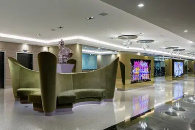 a lobby with green chairs and a statue at Little Havana 1br w pool gym near restaurants MIA-48 in Miami