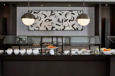 a buffet in a restaurant with food on a table at AC Hotel Miami Wynwood in Miami