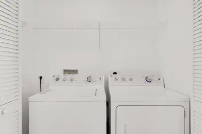 a white kitchen with a dishwasher in a room at Pool - Apartment with Balcony - Gym - Near Beach in Hallandale Beach