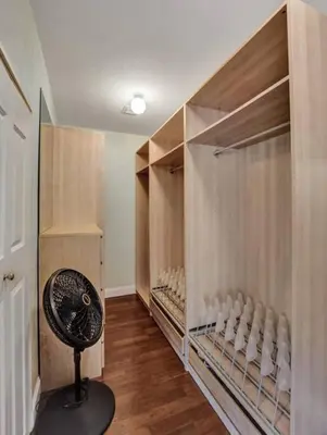 a room with a closet with a fan in it at Hot Tub! Roof Top! Firepit! Boat Dock! in Fort Lauderdale