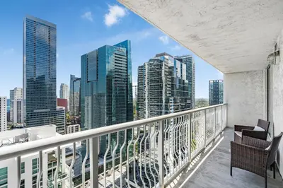 a balcony with chairs and a view of the city at Fantastic 2BR Condo on 31st Floor Free Parking in Miami