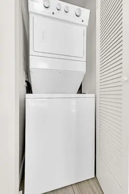 a white stove top oven sitting on top of a refrigerator at Devereaux Miami Luxury One-Bedroom and Studios in Miami