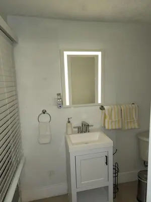 a white bathroom with a sink and a mirror at 1161 Studio 2 Miami in Tamiami