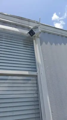 a garage door with a security camera on the side of it at 1161 Studio 2 Miami in Tamiami
