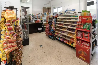 a grocery store aisle with a lot of food at Modern Oceanview Condo - Steps to the Beach! in Miami Beach