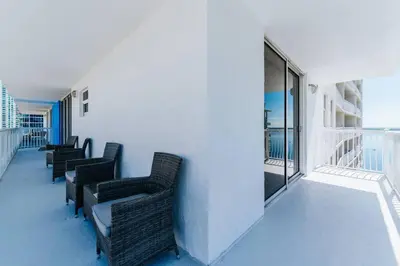 a row of chairs sitting on a balcony at Brickell, Miami Home in the Sky! in Miami