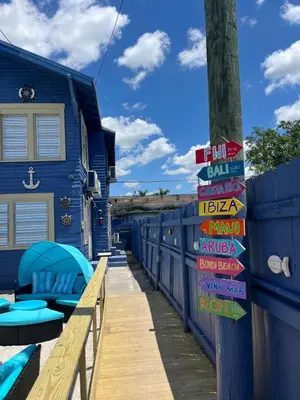 a blue building with signs on the side of it at Blue Little Havana in Miami