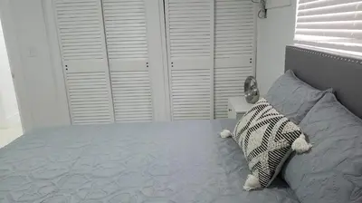 a bedroom with a bed with a pillow on it at Funston in Hollywood