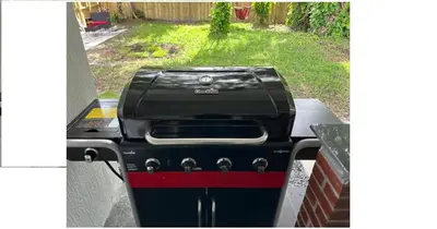 a grill sitting on a counter in a backyard at Enjoy our brand new home close to Hollywood in Hallandale Beach! in Hallandale Beach