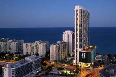 a city skyline with a tall building and the ocean at Lyfe-1005 in Hollywood