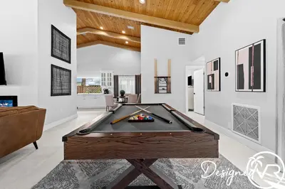a pool table in a living room with a ceiling at Villa wPool Firepit BBQ in Hollywood