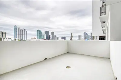 a white balcony with a view of the city at Wynwood 1br w gym pool lounge nr Midtown MIA-35 in Miami