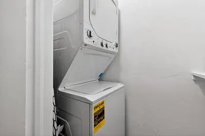 a refrigerator with its door open in a room at Sunny 2-Bedroom Miami Retreat with a Bright, Spacious Living Area & Relaxing Outdoor Seating in Fort Lauderdale