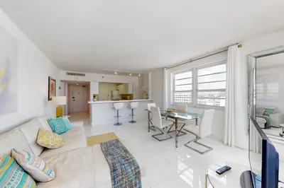 a living room with a couch and a table at Decoplage Paradise - Main Home in Miami Beach
