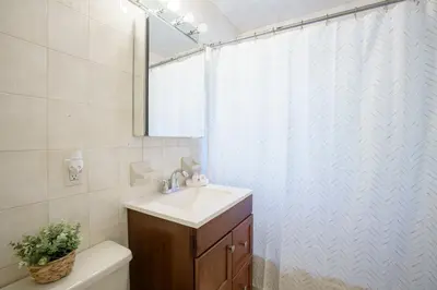 a bathroom with a sink and a shower curtain at Modern 3-Bedroom in the Heart of Wynwood Art District in Miami