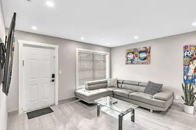 a living room with a couch and a table at Modern Villa with Pool Hollywood Hard Rock Casino in Fort Lauderdale