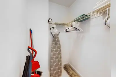 a room with a rack with a tie on a wall at Decoplage Paradise - Unit A in Miami Beach