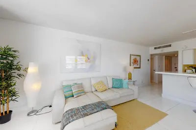 a white living room with a white couch at Decoplage Paradise - Unit B in Miami Beach