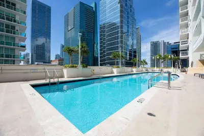 a swimming pool in a city with tall buildings at Ocean View Amazing Unit Brickell in Miami