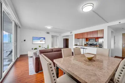a dining room and kitchen with a table and chairs at Ocean View Amazing Unit Brickell in Miami