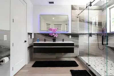 a bathroom with a sink and a mirror at The tropical paradise villa in Miami