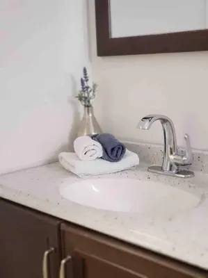 a bathroom counter with a sink and a towel at LOCATION! Apartment in Coconut Grove with parking in Miami