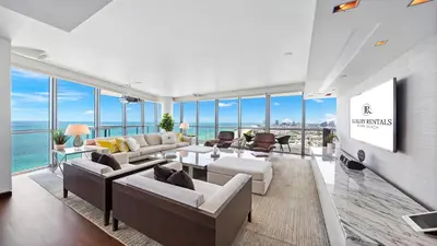 a living room with couches and a view of the ocean at Oceanfront Private Penthouse Condo at The Setai -3909 in Miami Beach