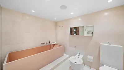 a bathroom with a tub and a toilet in it at Oceanfront Private Penthouse Condo at The Setai -3909 in Miami Beach