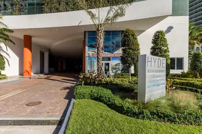 a building with a hvg sign in front of it at The Ultimate Resort - BEACHFRONT 2 BEDROOM APARTMENT WITH DIRECT OCEAN VIEW, ROOFTOP POOL, HOT TUB AND GYM in Hollywood