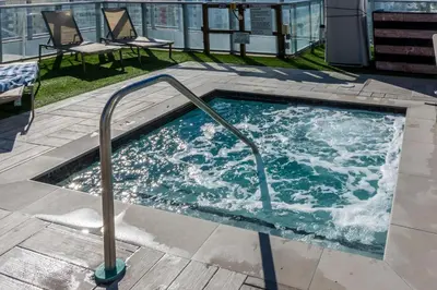 a jacuzzi tub on the top of a building at The Ultimate Resort - BEACHFRONT 2 BEDROOM APARTMENT WITH DIRECT OCEAN VIEW, ROOFTOP POOL, HOT TUB AND GYM in Hollywood