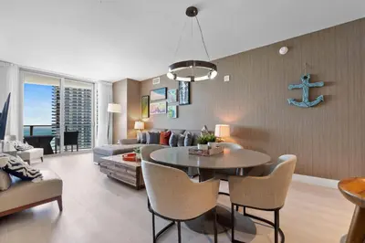 a living room with a table and a couch at Picturesque Beachfront Condo - LOVELY 2BD and 2BA APT WITH DIRECT OCEAN VIEW in Hollywood
