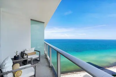 a balcony with a view of the ocean at Picturesque Beachfront Condo - LOVELY 2BD and 2BA APT WITH DIRECT OCEAN VIEW in Hollywood