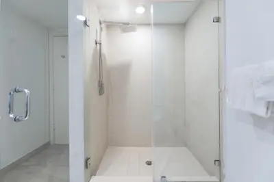 a bathroom with a shower with a glass door at Iconic Ocean View - in this Stunning Condo in Hollywood