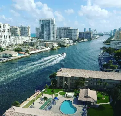 a view of a river with a boat in the water at Oceanfront Studio with Beach Pool & Restaurants 010B in Hallandale Beach