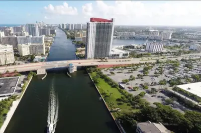 an aerial view of a city with a river and a bridge at BeachWalk Studio Apt with Beach Service 03B in Hallandale Beach