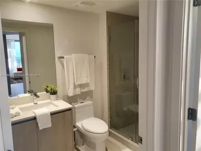 a bathroom with a toilet and a sink and a shower at Lux apartment Hyde Beach House in Hollywood