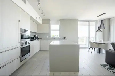 a kitchen with white cabinets and a white counter top at Lux apartment Hyde Beach House in Hollywood