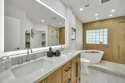 a bathroom with a sink and a tub and a toilet at 180 of Waterfront Heated Pool Walk To Beach Paradise Point Key RESIDENCES in Fort Lauderdale