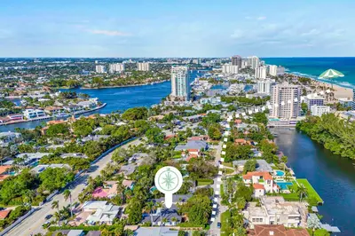 an aerial view of a city with a clock at Private neighborhood Heated Pool Walk To Beach Lush Surroundings Harbor Key in Fort Lauderdale