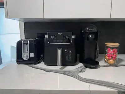 a counter with a coffee maker and other appliances on it at Amazing 3-bedroom modern home in Coral Gables area in Miami