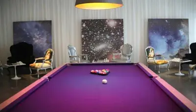 a purple pool table in a room with chairs at Wonderful 2 BR Condo Icon Brickell With Pool in Miami