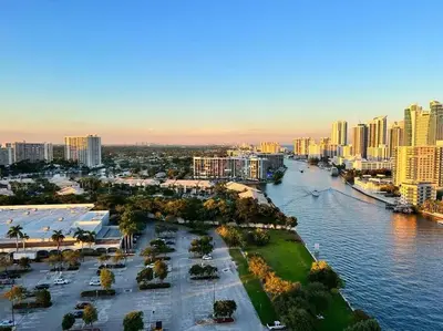 an aerial view of a city with a river and buildings at Chic Coastal Apartment, Views, Comfort & Full Kitchen -A in Hallandale Beach