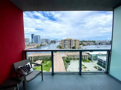 a balcony with a view of a river at Modern Beach Studio, 2 Full Beds, Prime Location in Hallandale Beach