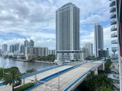 a city with a bridge over a river and buildings at Modern Beach Studio, 2 Full Beds, Prime Location in Hallandale Beach