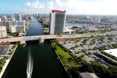 a bridge over a river in a city with buildings at Modern Beach Studio, 2 Full Beds, Prime Location in Hallandale Beach