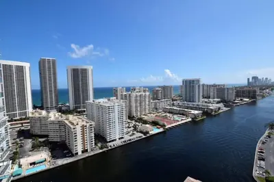 an aerial view of a city with a river and buildings at Your Coastal Studio, 2 Full Beds & Ocean Vibes in Hallandale Beach