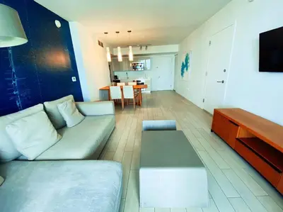 a living room with a couch and a table at Elegance in Miami Beach, Kitchen & Views -A in Hallandale Beach