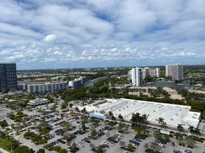 an aerial view of a parking lot in a city at Elegance in Miami Beach, Kitchen & Views -A in Hallandale Beach