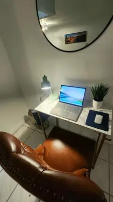 a laptop computer sitting on a desk with a chair at Bayfront Apartment Breathtaking Views- one bedroom w balcony- living room -Free Parking in Miami Beach